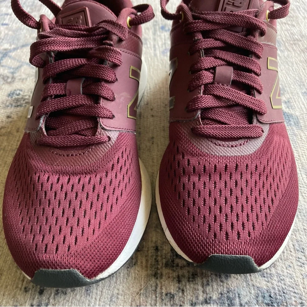 New Balance women’s Burgundy Sneakers with Gold Accent